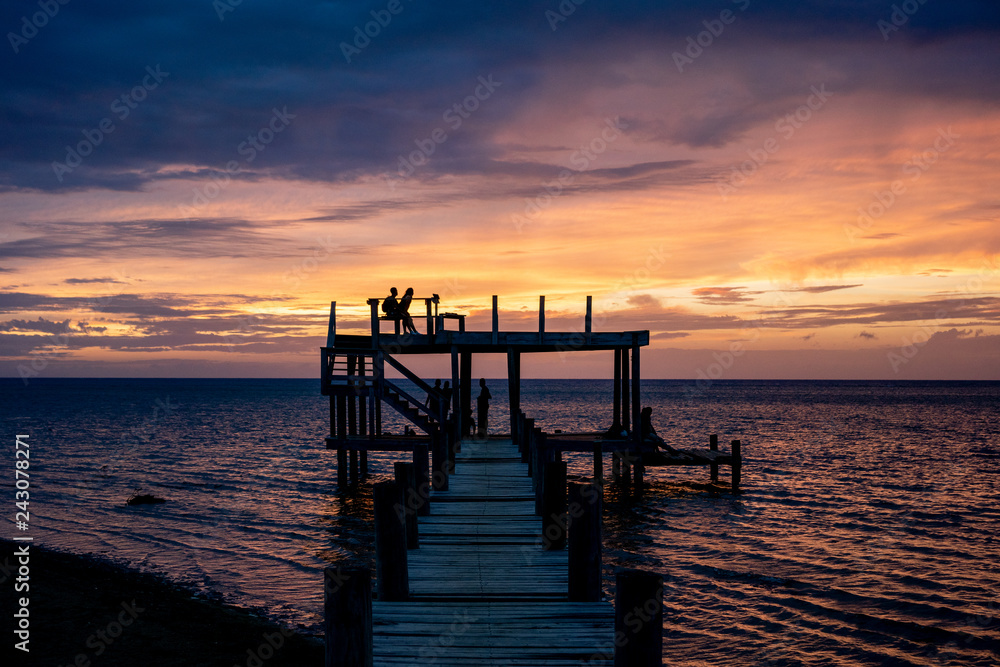Silhouette of Family on Pier at Sunset