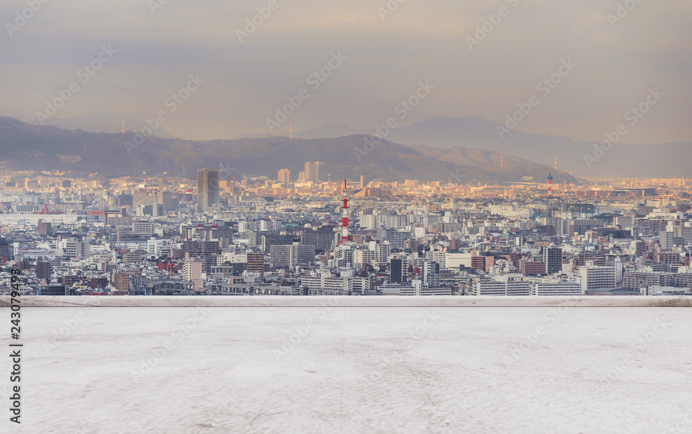 Obraz premium Osaka city skyline, downtown business district in sunset with empty concrete floor