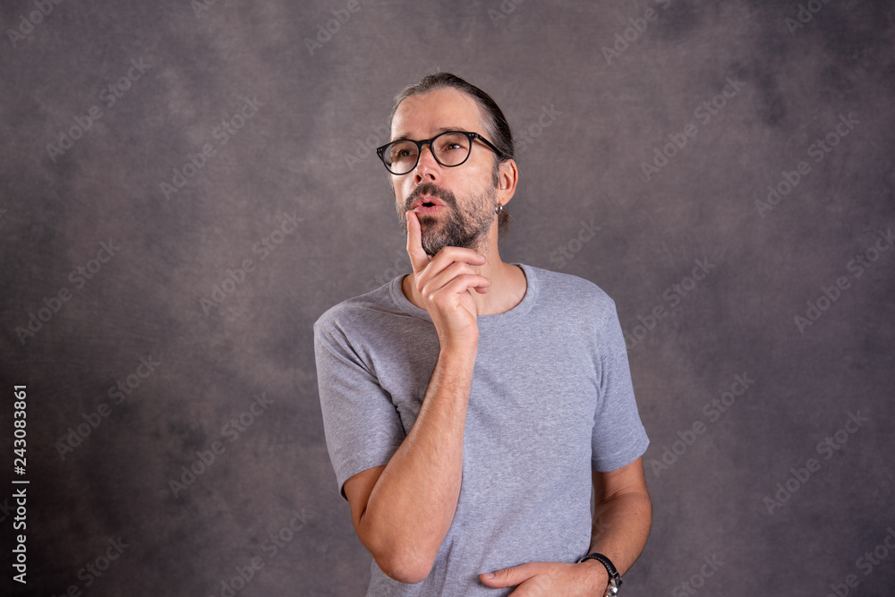 young man with glasses is reflecting young man with glasses is reflecting