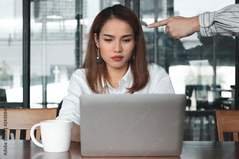 Hand of angry boss pointing anxious stressed Asian business woman in office. Hand of angry boss pointing anxious stressed Asian business woman in office.
