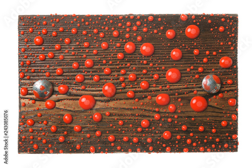 Natural frame made from plank with metal bolts in drops of red paint. Isolated