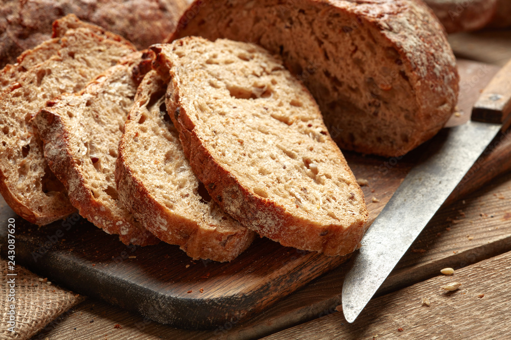 fresh baked sliced bread on wooden background