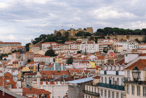Panoramic view at historical buildings and Castle of Saint George, Portugal, Lisbon. Cityscape of Lisboa. European buildings and architecture. Travel concept. Aerial view of Lisbon.