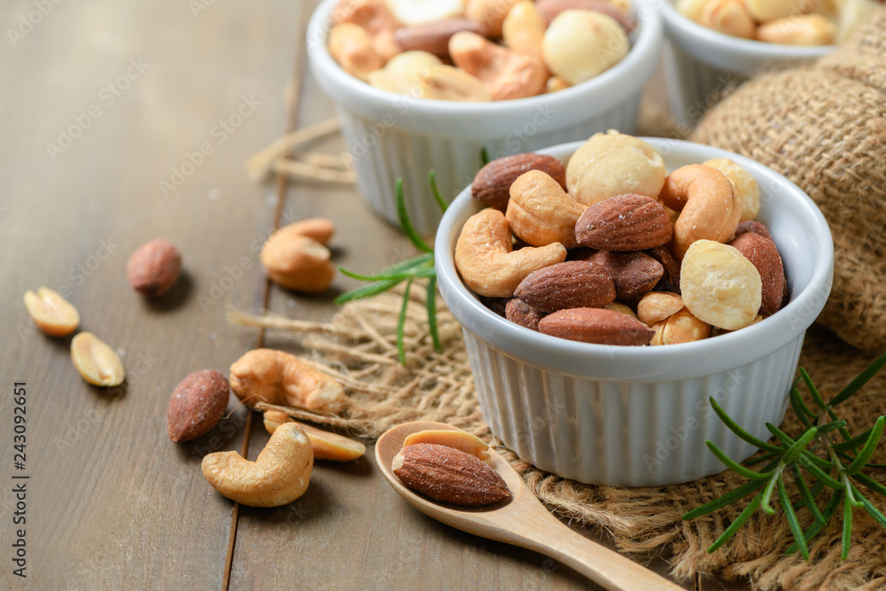 salted cocktail nuts on wood background, salted cocktail nuts on wood background,