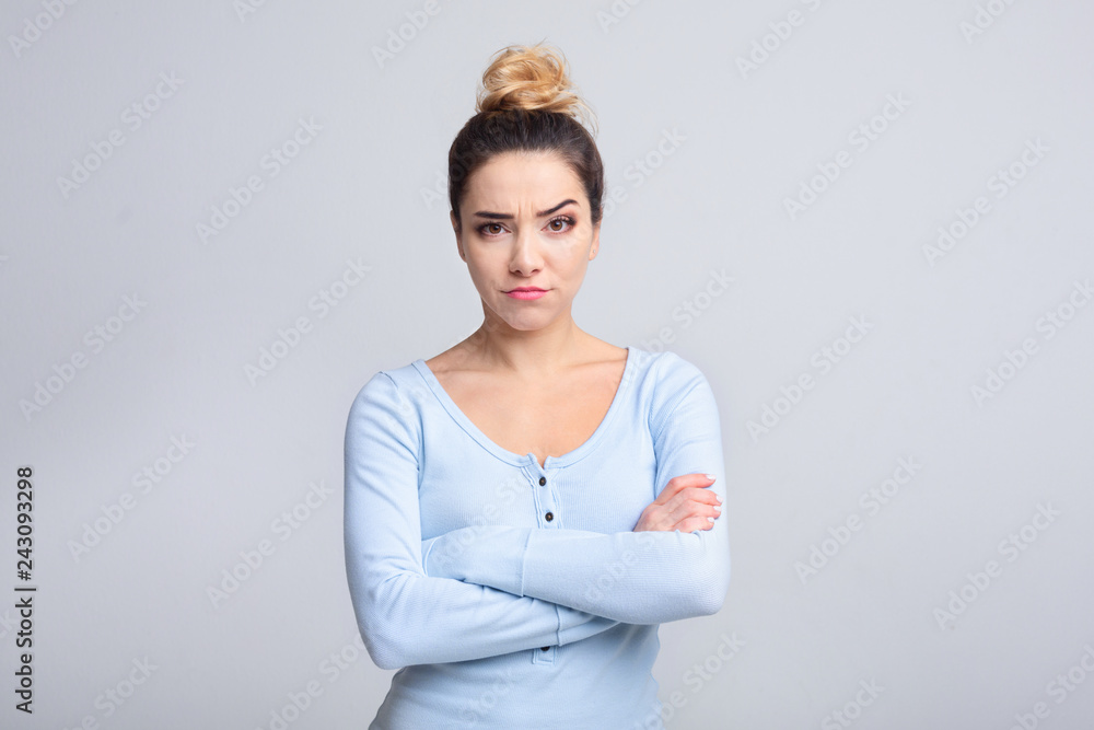 Thoughtful young woman having doubts over background Thoughtful young woman having doubts over background
