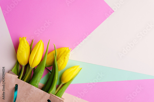 Fototapeta Naklejka Na Ścianę i Meble -  mothers day, valentine, women day, spring flower composition with yellow tulips bouquet on pastel background. springtime welcoming banner template