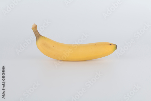 a tasty yellow banana with a white background