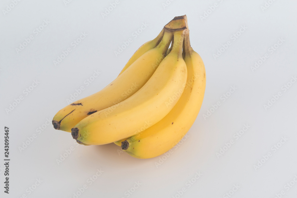 a tasty yellow banana with a white background