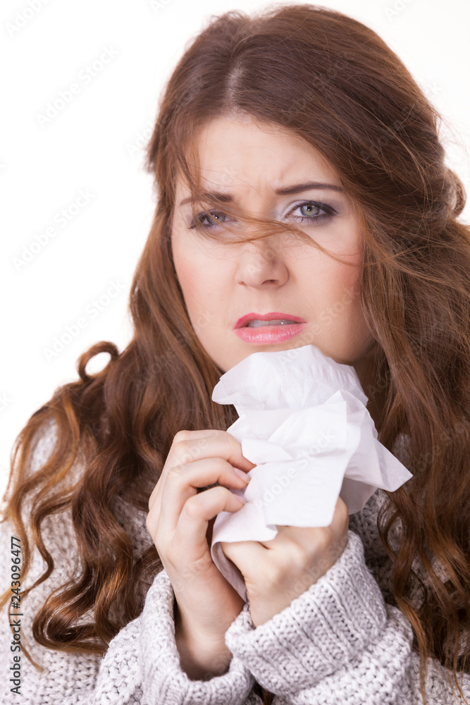 Sick freezing woman sneezing in tissue Sick freezing woman sneezing in tissue