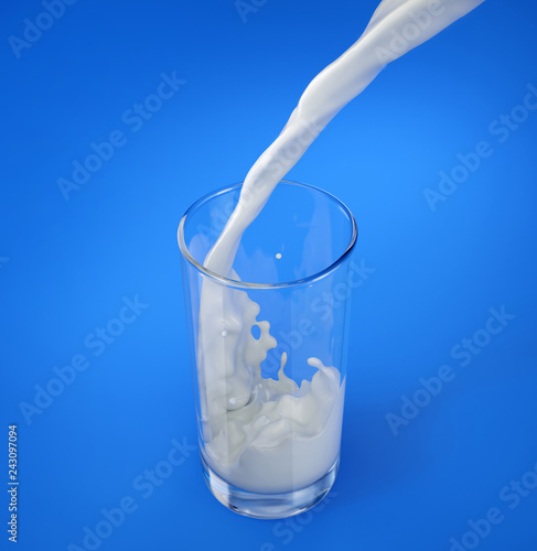 Glass of fresh milk with pouring and splash. On blue.