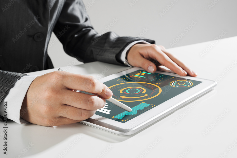 Media technologies for business as concept with woman working on tablet Media technologies for business as concept with woman working on tablet