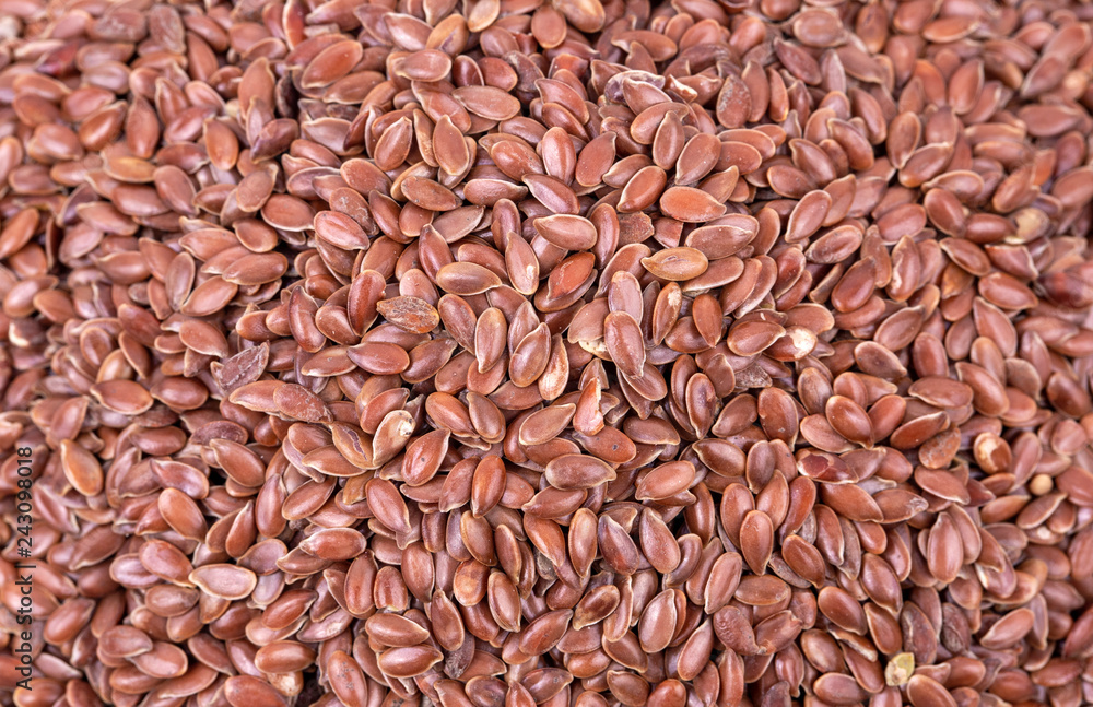 Pile of flax seeds isolated on white background close Pile of flax seeds isolated on white background close