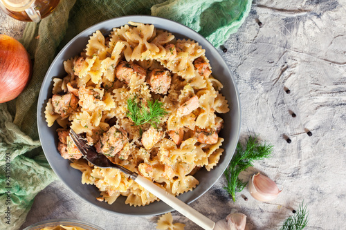 Creamy farfalle pasta with salmon, parmesan cheese and dill