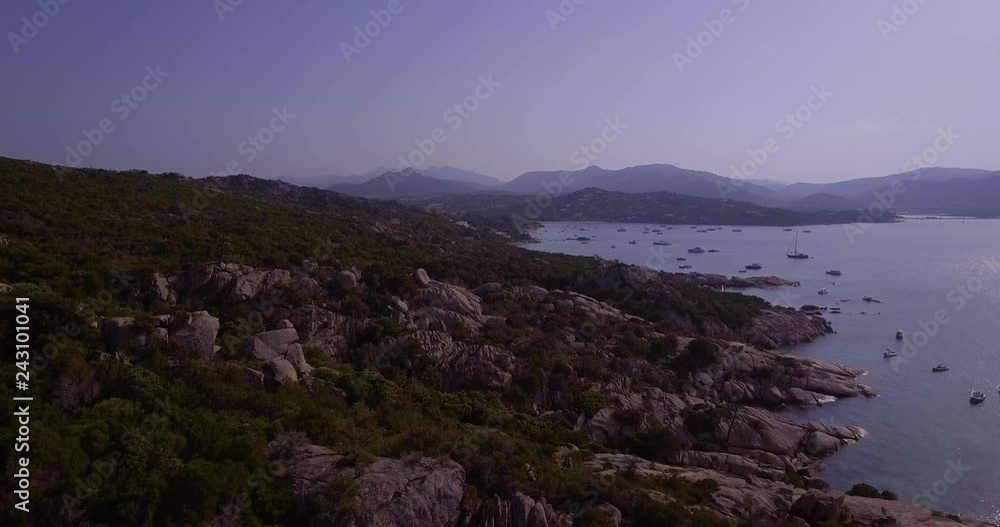 Aerial, Sardinia island and its rocky shore with mediterranean vegetation and beautiful emerald sea Aerial, Sardinia island and its rocky shore with mediterranean vegetation and beautiful emerald sea
