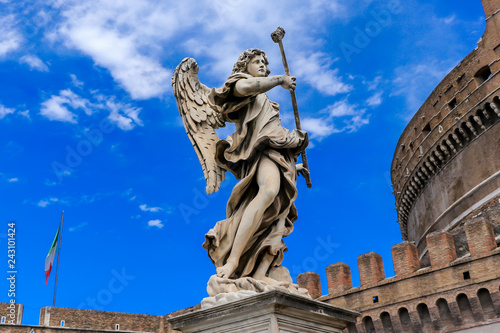 Statue of an angel on the background Castle Sant'Angelo, Rome, Italy