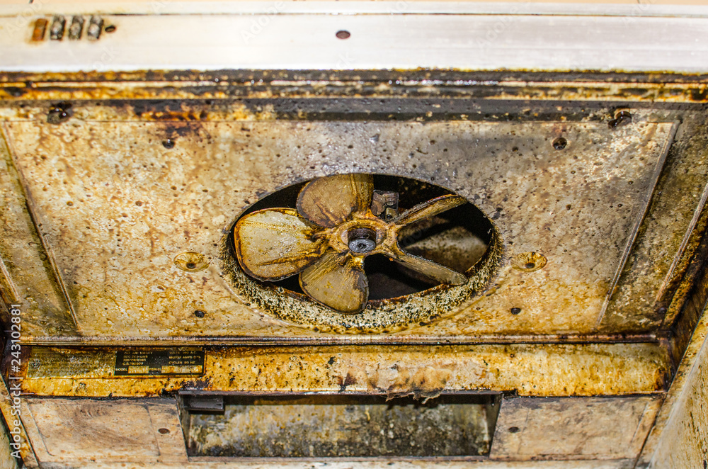 Dirty and greasy exhaust fan Kitchen hood. Stock Photo Adobe Stock