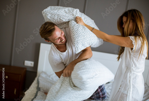 Playful young couple having...