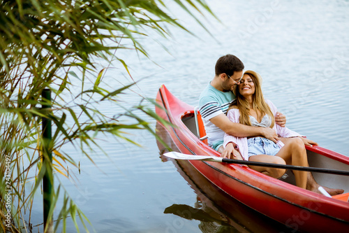Loving couple rowing on the lake © BGStock72