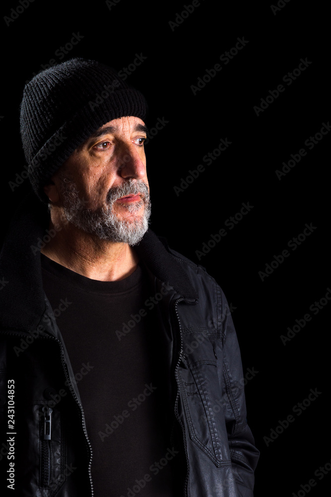 Portrait of adult man with hat, isolated on black background Portrait of adult man with hat, isolated on black background
