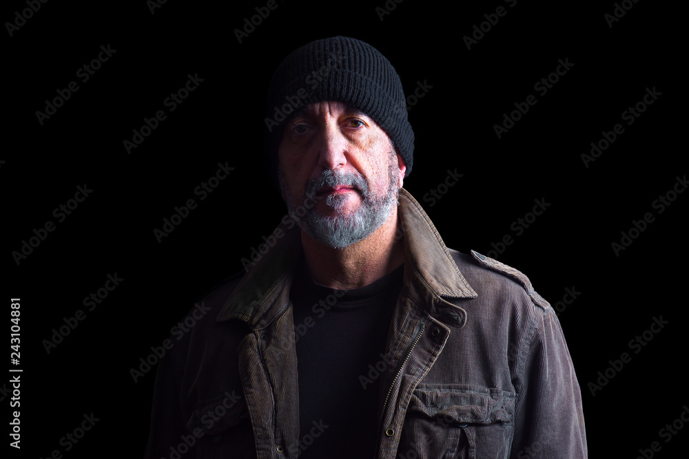 Portrait of adult man with hat, isolated on black background Portrait of adult man with hat, isolated on black background