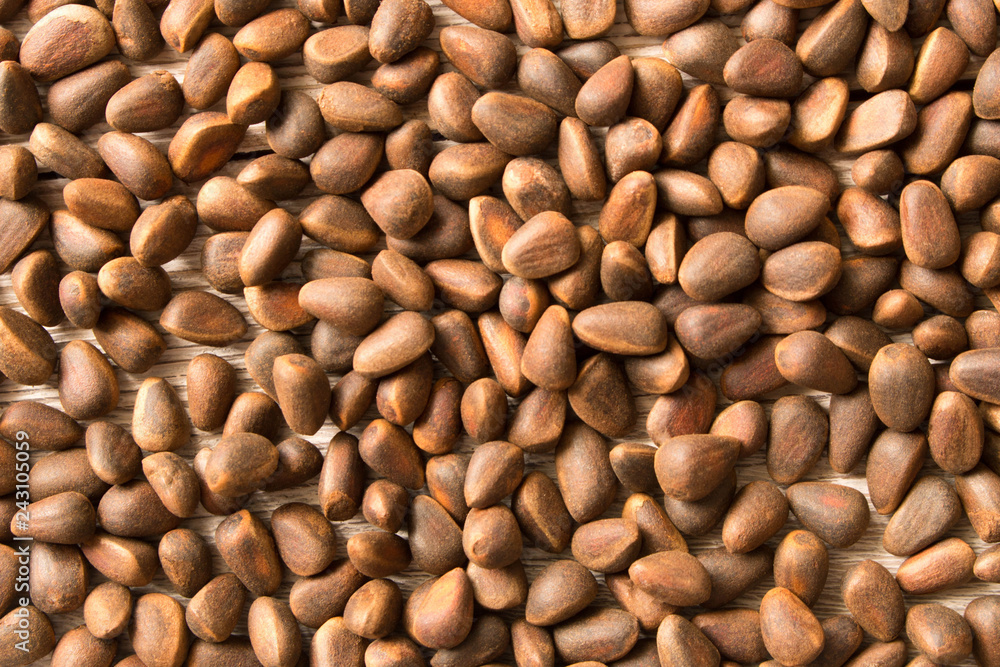 Pine nuts background texture. Natural food. Selective focus Pine nuts background texture. Natural food. Selective focus