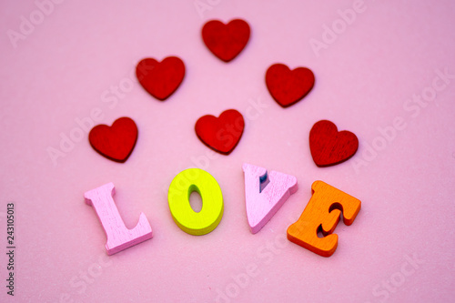 the word love Valentine's day with colorful wooden letters. Love and heart - a symbol of Valentine's day. macro.