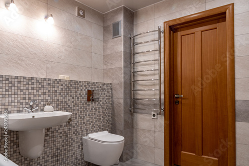 interior of modern bathroom with bath  shower and toilet