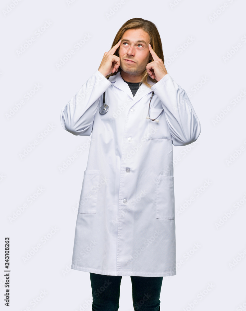 Doctor man having doubts and thinking on isolated background