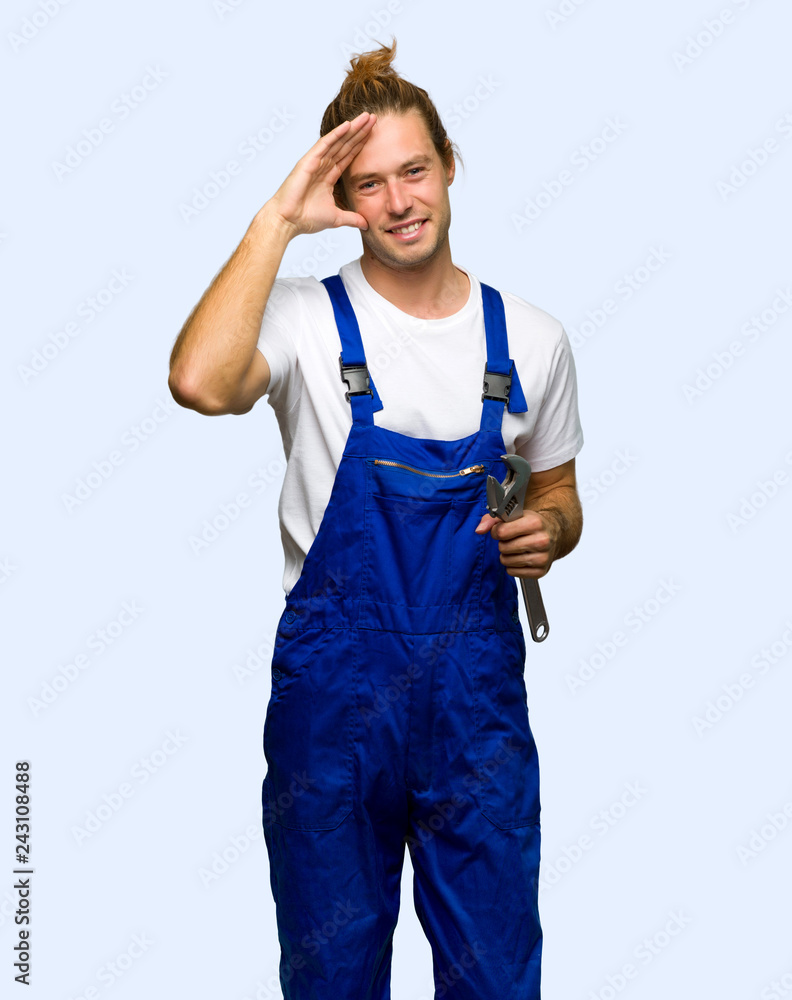 Workman saluting with hand on isolated background Workman saluting with hand on isolated background