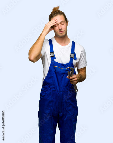 Workman with tired and sick expression on isolated background