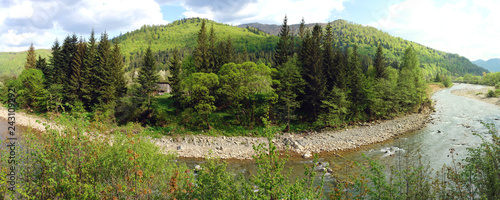 beautiful panorama with a river in the spring mountains
