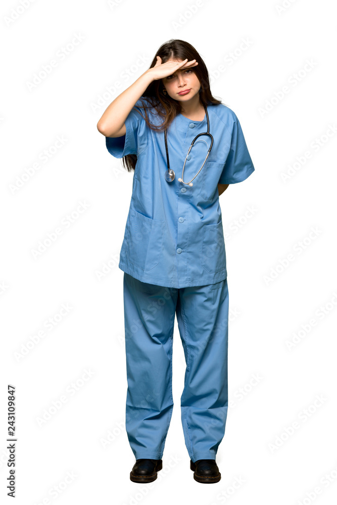 Full-length shot of Young nurse looking far away with hand to look something on isolated white background Full-length shot of Young nurse looking far away with hand to look something on isolated white background