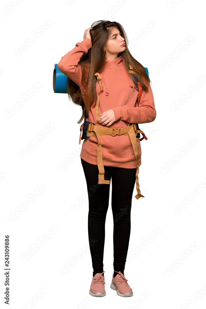 Full-length shot of Hiker girl having doubts while scratching head on isolated white background Full-length shot of Hiker girl having doubts while scratching head on isolated white background