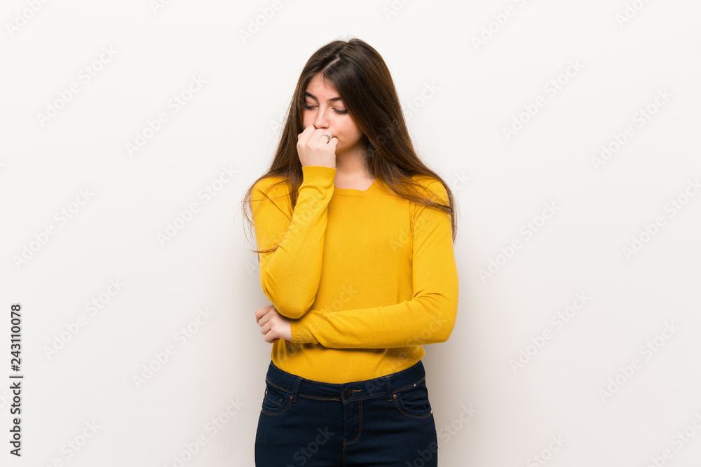 Young woman with yellow sweater having doubts Young woman with yellow sweater having doubts