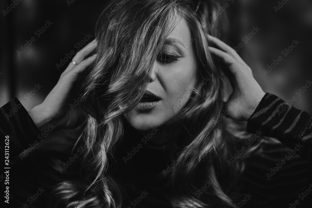 Cheerful girl hands combing hair. Portrait of beaming lady. Cheerful girl hands combing hair. Portrait of beaming lady.