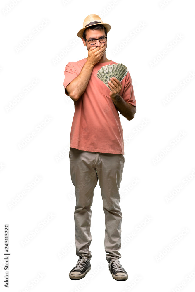 Man holding many bills covering mouth with hands for saying something inappropriate on isolated white background Man holding many bills covering mouth with hands for saying something inappropriate on isolated white background