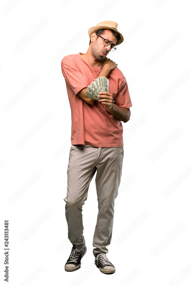 Man holding many bills suffering from pain in shoulder for having made an effort on isolated white background