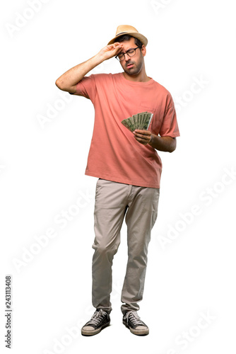 Man holding many bills with tired and sick expression on isolated white background