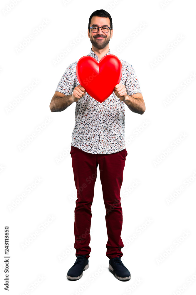 Handsome man with glasses holding a heart icon Handsome man with glasses holding a heart icon