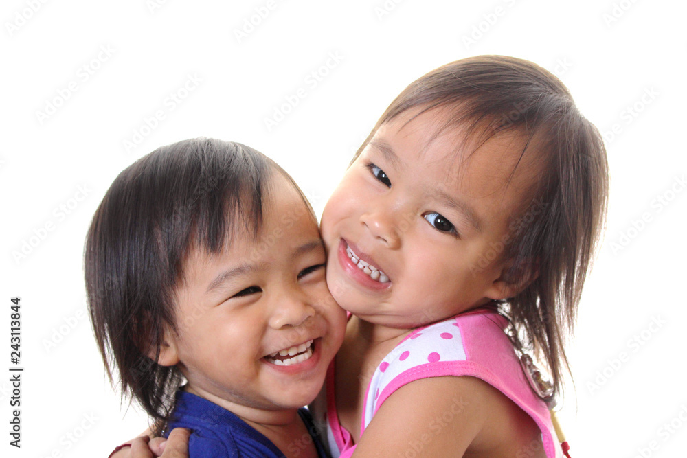 two little Asian girls sisters hugging happy. two little Asian girls sisters hugging happy.
