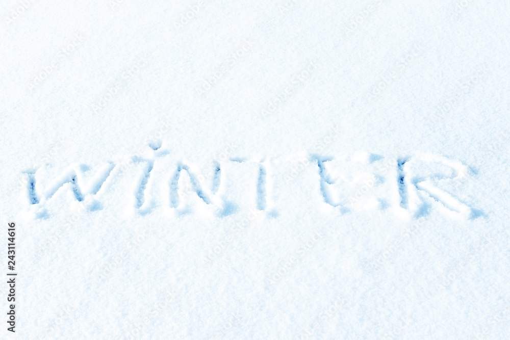 Text Hello winter and little blue pail of snow. Pastel color, snowy greeting card. Winter holidays concept. Text Hello winter and little blue pail of snow. Pastel color, snowy greeting card. Winter holidays concept.