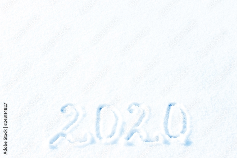 2020 New year. 2020 year painted on a snowy background. Figures two thousand and twenty of snow. 2020 New year. 2020 year painted on a snowy background. Figures two thousand and twenty of snow.