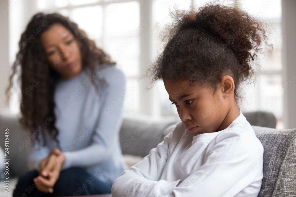 Mom or psychologist talking counseling upset offended african american child girl feels sad insulted, sulky frustrated black mixed race kid daughter having psychological trauma depression problem - obrazy, fototapety, plakaty 