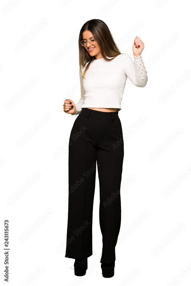 Full body of Pretty woman with glasses enjoy dancing while listening to music at a party Full body of Pretty woman with glasses enjoy dancing while listening to music at a party