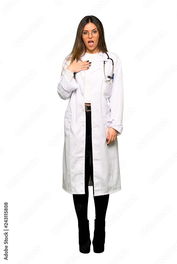 Full body of Young doctor woman surprised and shocked while looking right Full body of Young doctor woman surprised and shocked while looking right