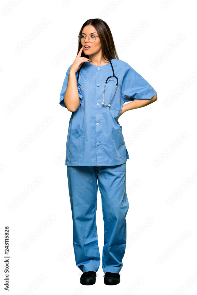 Full body of Young nurse having doubts while looking up Full body of Young nurse having doubts while looking up