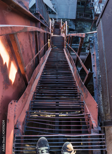 Fototapeta Naklejka Na Ścianę i Meble -   Metal ladder of old metallurgical plant