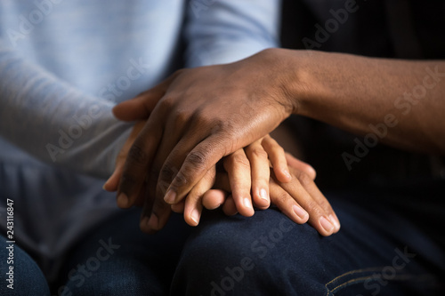 African american black couple husband and wife holding hands as psychological counseling support concept, understanding care in love, comfort empathy honesty trust in relationships, close up view