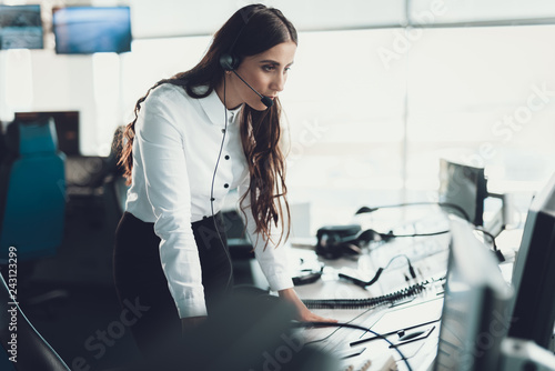 One female operator staying near dispatch board