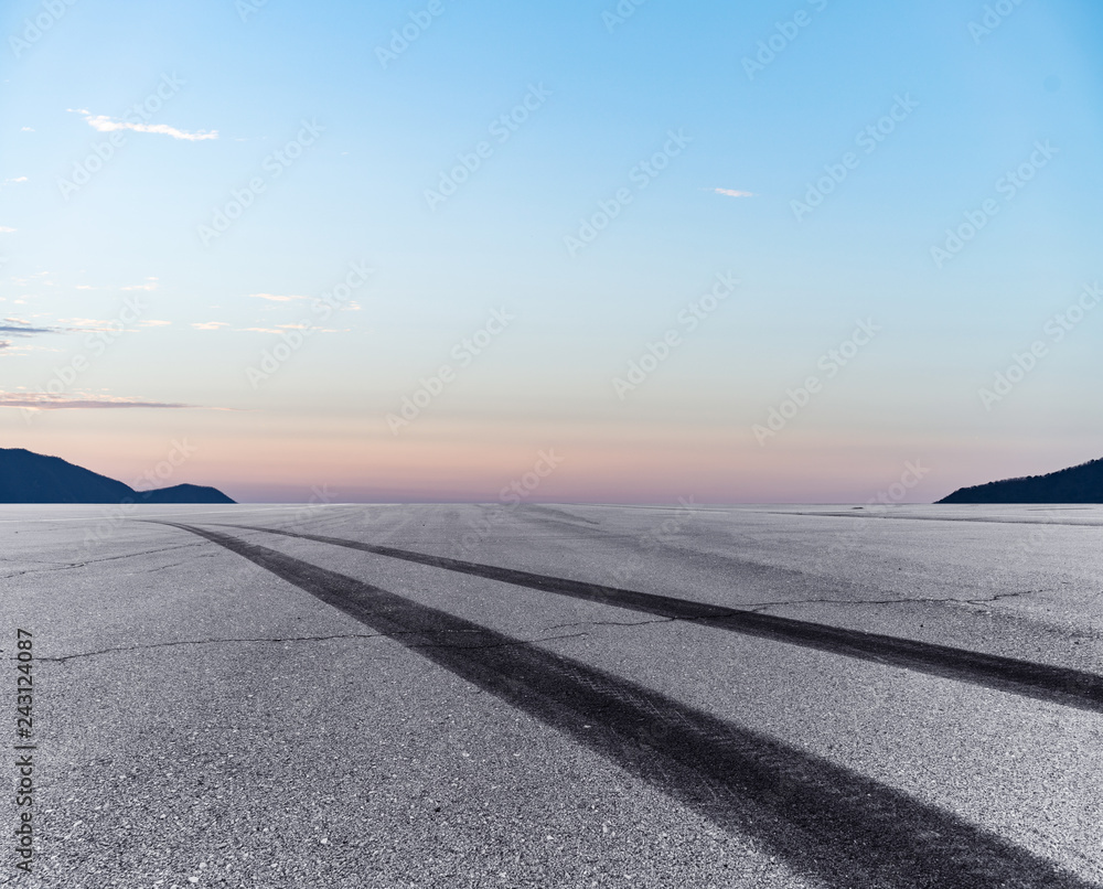 Empty road and mountain sunset background